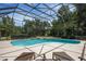 Screened pool with lounge chairs at 3413 Lilas Ct, Windermere, FL 34786