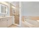 Spa-like bathroom with a soaking tub, walk-in shower, and updated fixtures at 350 Carolina Ave # 301, Winter Park, FL 32789