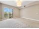 Bright bedroom with sliding glass doors and plush carpeting at 350 Carolina Ave # 301, Winter Park, FL 32789