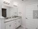 Bathroom with double vanity, granite countertop and modern fixtures at 4284 Sagefield Drive, St Cloud, FL 34773