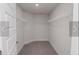 Large walk-in closet with wire shelving and neutral carpeting at 4284 Sagefield Drive, St Cloud, FL 34773