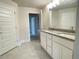 Double vanity bathroom with granite countertops and upgraded faucets at 4312 Sagefield Drive, St Cloud, FL 34773