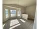 Bright dining area with large windows and a stylish chandelier at 4486 Segafield, St Cloud, FL 34773