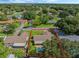 Aerial view of house with pool and backyard at 5405 Justine Way, Winter Park, FL 32792