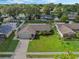 House with driveway and yard; aerial view at 5405 Justine Way, Winter Park, FL 32792