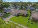 Aerial view showcasing house and well-maintained lawn at 5405 Justine Way, Winter Park, FL 32792
