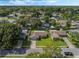Aerial view of the charming neighborhood and the home with a well-manicured front lawn at 5405 Justine Way, Winter Park, FL 32792