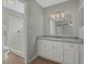 Updated bathroom with granite vanity, white cabinets, and a walk-in shower at 5405 Justine Way, Winter Park, FL 32792