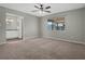 Spacious bedroom with neutral walls, ceiling fan, and carpet flooring at 5405 Justine Way, Winter Park, FL 32792