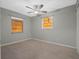 Well-lit bedroom with two windows and ceiling fan at 5405 Justine Way, Winter Park, FL 32792