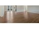 Spacious living area with hardwood floors and access to kitchen and backyard at 5405 Justine Way, Winter Park, FL 32792