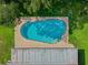 Aerial view of the large swimming pool, patio, and lawn in the backyard of the home at 5405 Justine Way, Winter Park, FL 32792