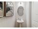 Stylish bathroom with pedestal sink and frameless mirror at 676 Kimber Ln # 37, Debary, FL 32713
