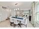 Open concept dining room with modern lighting and kitchen view at 676 Kimber Ln # 37, Debary, FL 32713