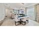 Bright dining room with modern light fixture and seating for six at 676 Kimber Ln # 37, Debary, FL 32713