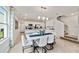 Open concept dining room with kitchen island and staircase at 676 Kimber Ln # 37, Debary, FL 32713