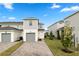 Modern townhouse with attached garage and landscaped yard at 676 Kimber Ln # 37, Debary, FL 32713