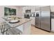 Granite island kitchen with stainless steel appliances at 676 Kimber Ln # 37, Debary, FL 32713