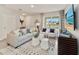 Living room with comfortable seating and large window at 676 Kimber Ln # 37, Debary, FL 32713