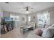 Bright living room with tile floors and plenty of natural light from large windows at 754 Canovia Ave, Orlando, FL 32804