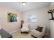 Relaxing sitting room featuring two chairs and neutral decor at 754 Canovia Ave, Orlando, FL 32804