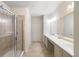 Elegant bathroom with double vanity and a glass shower at 8321 Bella Vida Cir # 8321, Davenport, FL 33896