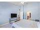 Bright bedroom featuring a king-size bed and access to a full bathroom at 8321 Bella Vida Cir # 8321, Davenport, FL 33896