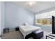 Peaceful bedroom with a comfortable bed and plenty of light at 8321 Bella Vida Cir # 8321, Davenport, FL 33896