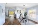 Modern glass dining table with seating for four in an open-concept space at 8321 Bella Vida Cir # 8321, Davenport, FL 33896