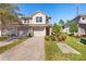 Two-story townhome with two-car garage and landscaped front yard at 8321 Bella Vida Cir # 8321, Davenport, FL 33896
