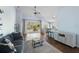 Open living space with hardwood floors, balcony access, and modern decor at 8321 Bella Vida Cir # 8321, Davenport, FL 33896