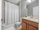 Clean bathroom with shower/tub combo and wood vanity at 8876 Candy Palm Rd, Kissimmee, FL 34747