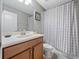 Clean bathroom with single sink vanity, shower/tub combo, and updated fixtures at 8876 Candy Palm Rd, Kissimmee, FL 34747