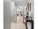 Bright and spacious entryway with tile flooring and console table at 8876 Candy Palm Rd, Kissimmee, FL 34747