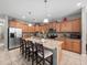 Modern kitchen with light wood cabinets, granite counters, and island at 8876 Candy Palm Rd, Kissimmee, FL 34747
