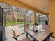 Private screened patio with table and chairs, overlooking the pool at 8876 Candy Palm Rd, Kissimmee, FL 34747