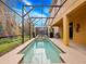 Private screened pool area with plenty of space for relaxing at 8876 Candy Palm Rd, Kissimmee, FL 34747