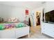 Cozy bedroom with a white bed frame and colorful quilt at 933 El Lago Ter, Winter Springs, FL 32708