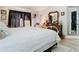 Primary bedroom with large bed, ornate dresser, and mirror at 933 El Lago Ter, Winter Springs, FL 32708
