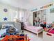 ' bedroom with twin beds, ample closet space, and playful decor at 933 El Lago Ter, Winter Springs, FL 32708