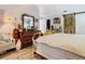 Primary bedroom with king bed and rustic wooden dresser at 933 El Lago Ter, Winter Springs, FL 32708