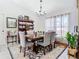 Formal dining room with wooden table, chairs, and a chandelier at 933 El Lago Ter, Winter Springs, FL 32708