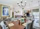 Bright dining room with wood table, chairs, and decorative accents at 933 El Lago Ter, Winter Springs, FL 32708