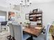 Dining room features a wood table, chairs, and a decorative hutch at 933 El Lago Ter, Winter Springs, FL 32708