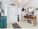 Bright and spacious entryway with tile flooring and decorative console table at 933 El Lago Ter, Winter Springs, FL 32708