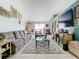 Spacious living room featuring a large sofa, coffee table, and decorative accents at 933 El Lago Ter, Winter Springs, FL 32708