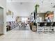 Open concept living space with a comfortable couch and kitchen views at 933 El Lago Ter, Winter Springs, FL 32708
