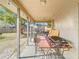 Covered patio with seating area and backyard view at 933 El Lago Ter, Winter Springs, FL 32708