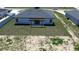 A modern home features a backyard with a pergola covered patio, perfect for outdoor entertaining at 105 Marion Oaks Manor, Ocala, FL 34473