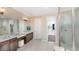 Elegant Primary bathroom with double vanity and walk-in shower at 1212 Teal Creek Dr, St Cloud, FL 34769